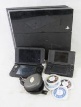 A PS4 in black, a Nintendo 3DS XL visible damage noted, PSP games etc.