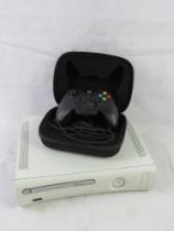 An Xbox 360 and a Razer Xbox controller in case.