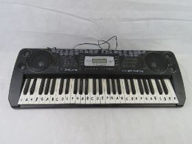 An electric keyboard. Disclaimer: electrical items are sold as untested and without guarantee.