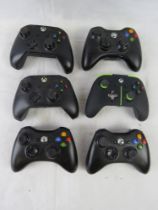 Six Xbox controllers. Disclaimer: electrical items are sold as untested and without guarantee.