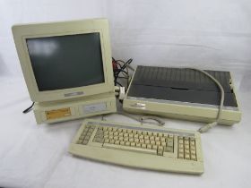 An Amstrad PCW9512 personal computer word processor with 512K keyboard and Daisywheel printer.