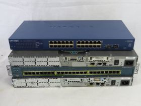 A Netgear GS724T and three other network switches.