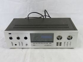 A Sansui quartz synthesizer DC R-99Z stereo receiver.