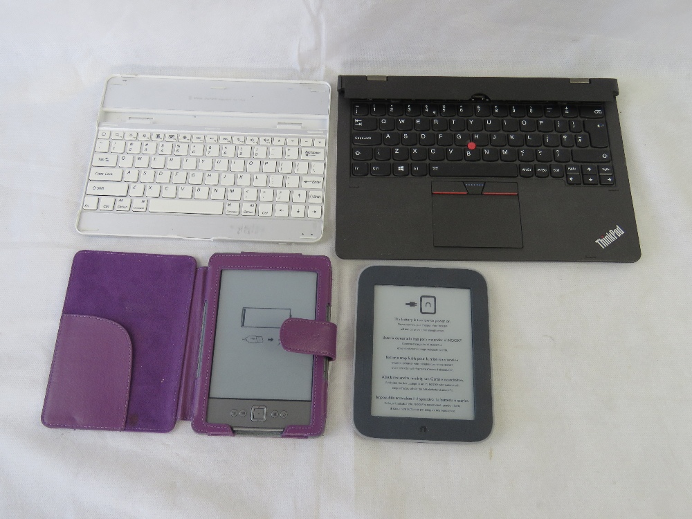 Two Kindles and two keyboard attachments.