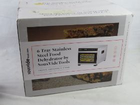 A stainless steel food dehydrator 'as new' in box.