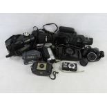 A quantity of assorted cameras including Kodak Brownie, Sony Handycam, Panasonic Palmcorder, etc.