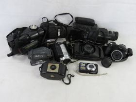 A quantity of assorted cameras including Kodak Brownie, Sony Handycam, Panasonic Palmcorder, etc.