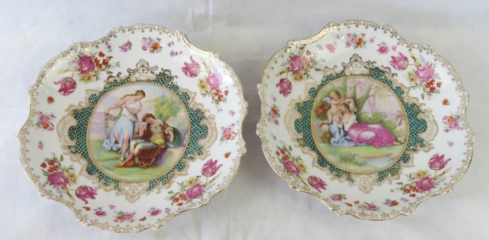 A pair of late 19th century Austrian porcelain decorative dishes in the Royal Vienna style,
