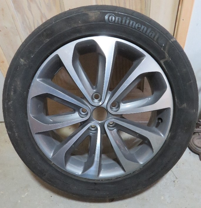 A Nissan Qashqai alloy wheel having Continental tyre upon.