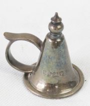A hallmarked silver candle snuffer.