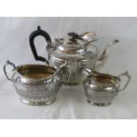 A silver plated tea set comprising jug, sugar and teapot.