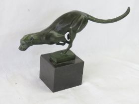 A delightful Art Deco style contemporary bronze on marble base of a running cheetah,