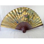 A large Japanese wall fan having dragon decoration and signature upon.