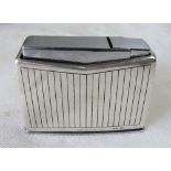 A Georg Jensen silver table lighter in a vertical lined Art Deco pattern C1950's.