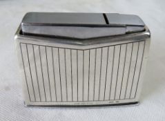 A Georg Jensen silver table lighter in a vertical lined Art Deco pattern C1950's.