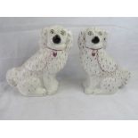 A pair of Staffordshire opposing Spaniel figures.