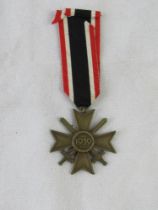 A WWII German War Service Cross with ribbon