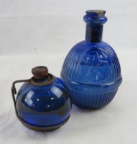Two Bristol blue glass fire grenades with contents, one marked STAR Hardens Hand Grenade.