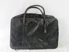 A black leather weekend bag.