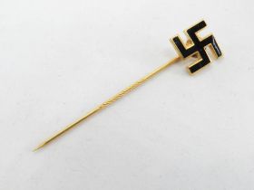A WWII German black enamel Swastika stick pin.