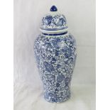 A tall blue and white Chinese style 'ginger jar' with lid.