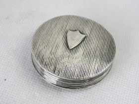 A silver pill pot having partial hallmarks.