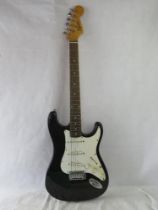 A Fender Squire Strat electric guitar in black.