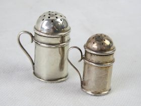 Two hallmarked silver novelty 'tankard' pepperettes.