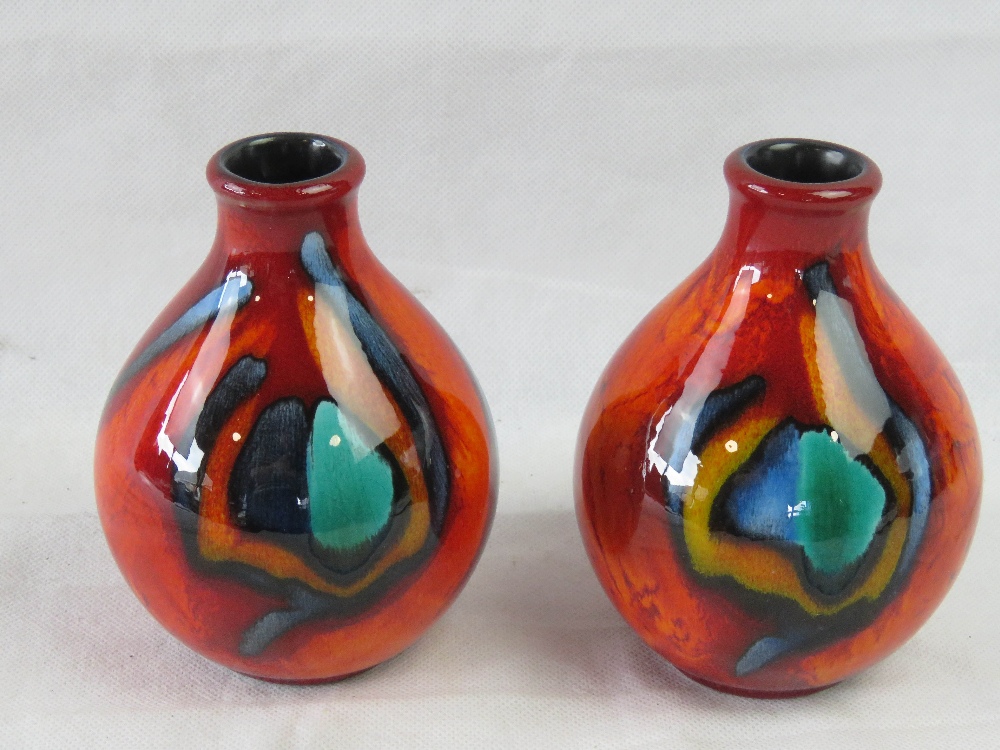 A pair of short Poole pottery vases, each 13cm high.