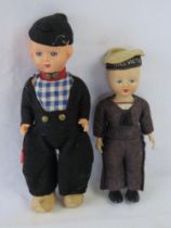Two vintage plastic dolls, one dressed as a HMS Victory Sailor uniform,