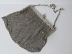 A HM silver chain link evening bag bearing Chester 1915 import hallmark to the pierced floral