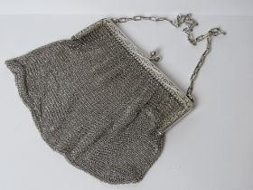 A HM silver chain link evening bag bearing Chester 1915 import hallmark to the pierced floral