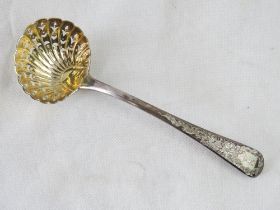 A Georgian (George III) hallmarked silver sugar sifter spoon having shell design bowl and stag