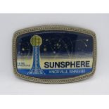 A 1982 Knoxville Tennessee World Fair Sunsphere belt buckle.