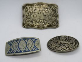 Three pressed metal vintage belt buckles.