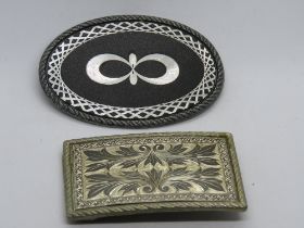 Two vintage belt buckles, each marked W to back.