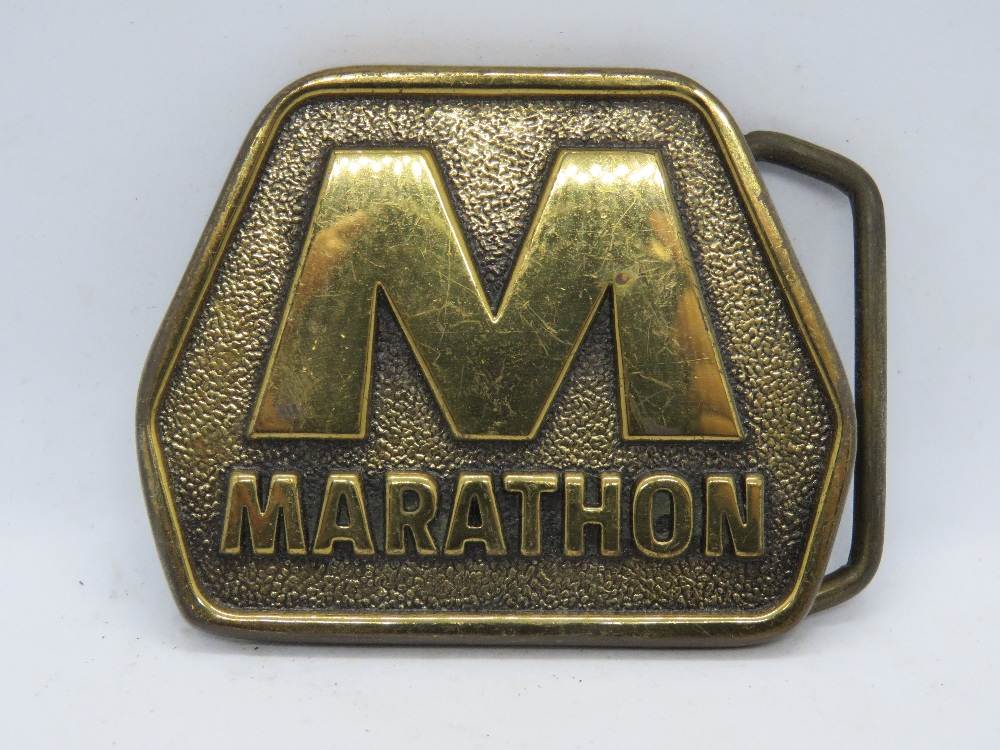 A vintage brass Marathon belt buckle made by Blue Bayou Brass Houston TX USA