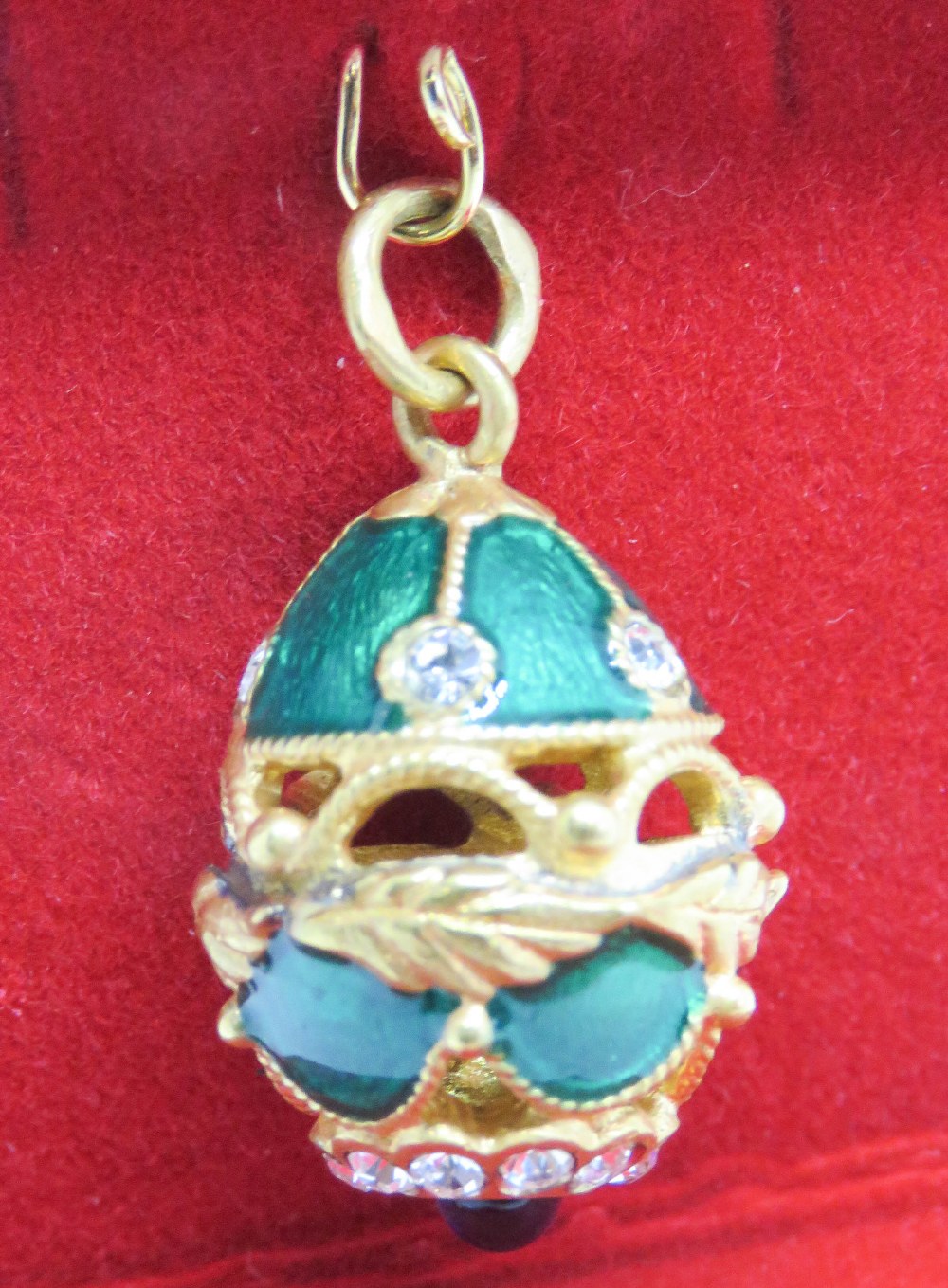 A 'Faberge' type egg charm having green enamel, white and blue stone decoration upon. - Image 3 of 3