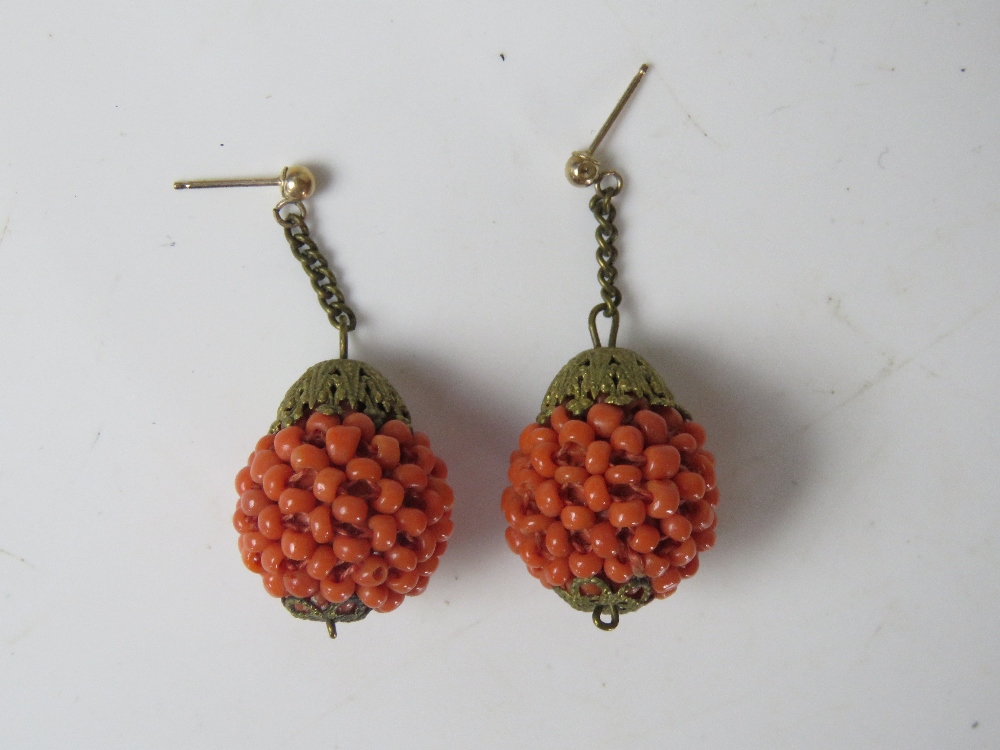 A pair of early century gilt metal and faux coral bead earrings.