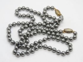 A pair of heamatite bead necklaces.