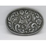 An American made floral belt buckle, marked USA to back.
