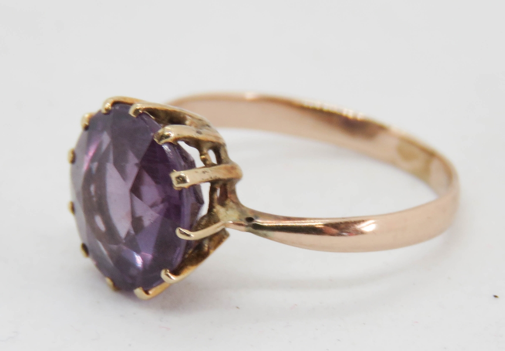 A stunning alexandrite solitaire ring, the round brilliant cut approx 9mm dia, band stamped 14, - Image 2 of 3