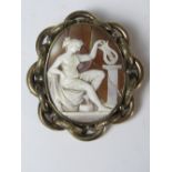 A large Victorian carved shell cameo brooch, pinchbeck frame,