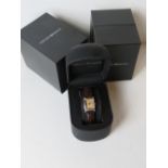 An Emporio Armani ladies watch in original box on original Armani embossed leather strap,