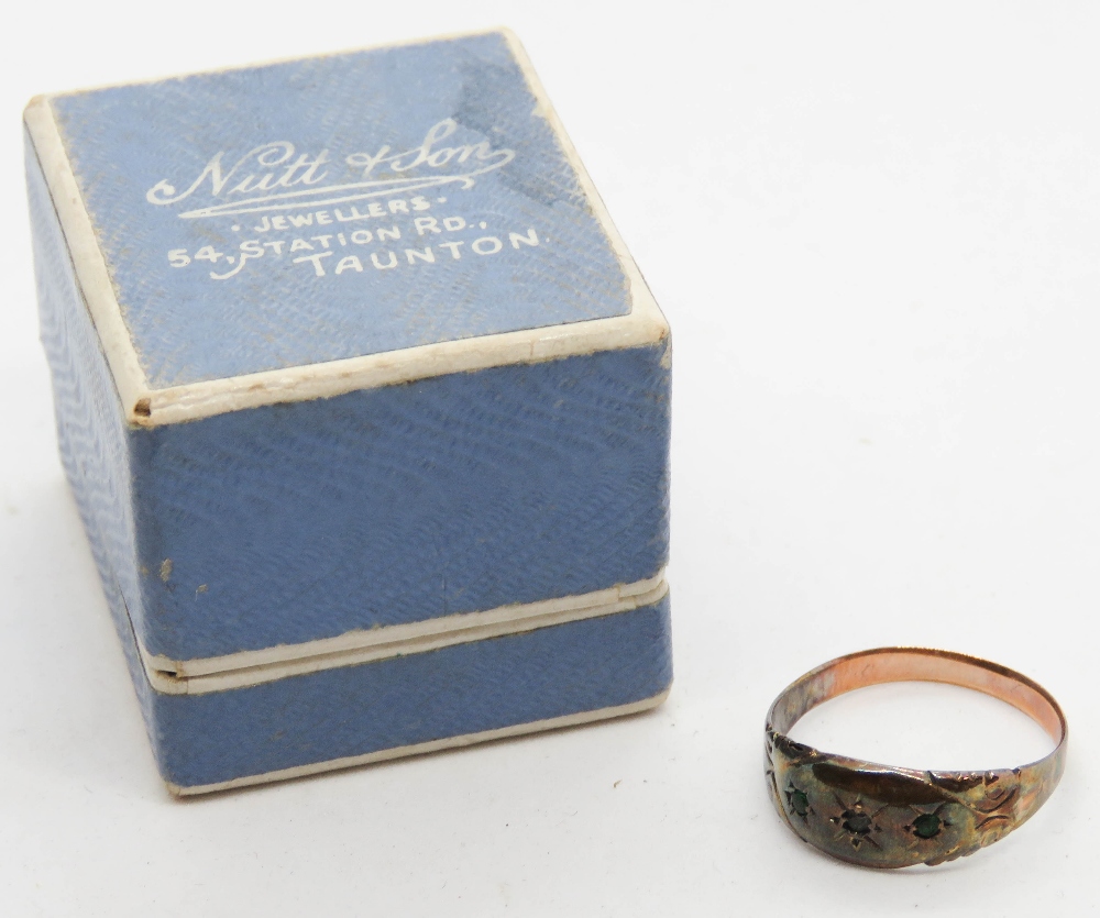 An antique rose metal ring set with three stones, no apparent hallmarks, size M-N, 1.3g.