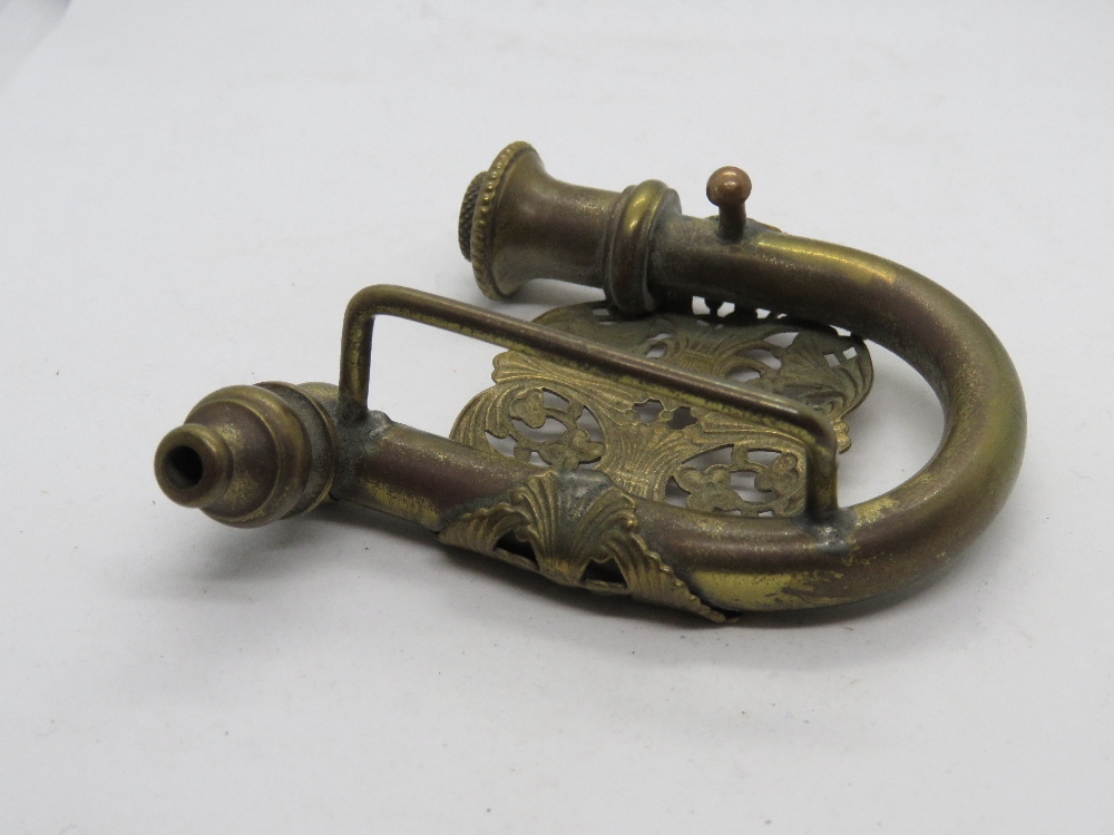 A c1970s brass hidden pipe belt buckle with pierced floral design. - Image 3 of 3