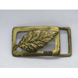 A vintage RJ Reynolds Tobacco USA belt buckle, marked to back with made in USA 1982.