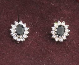 A pair of blue and white stone cluster stud earrings, no apparent hallmarks,