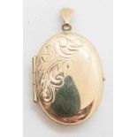 A 9ct gold locket, hallmarked 375, having part foliate engraving to front, 3g.