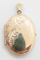 A 9ct gold locket, hallmarked 375, having part foliate engraving to front, 3g.